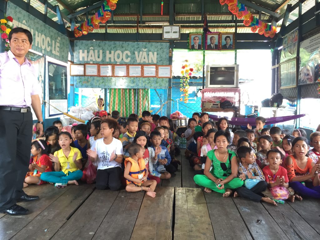 Teachers work voluntarily at a charity school at Tonle Sap