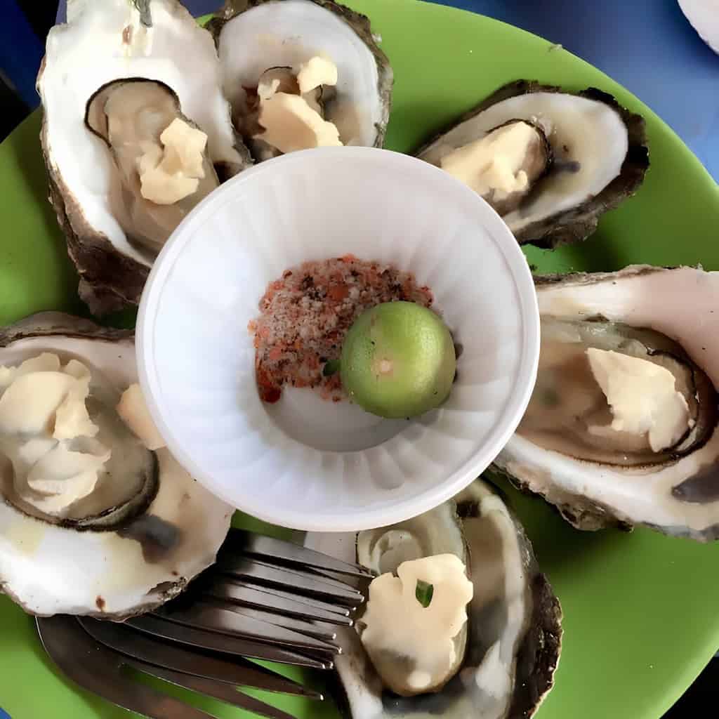 Grilled oysters served with Vietnamese salt and lime in Can Gio
