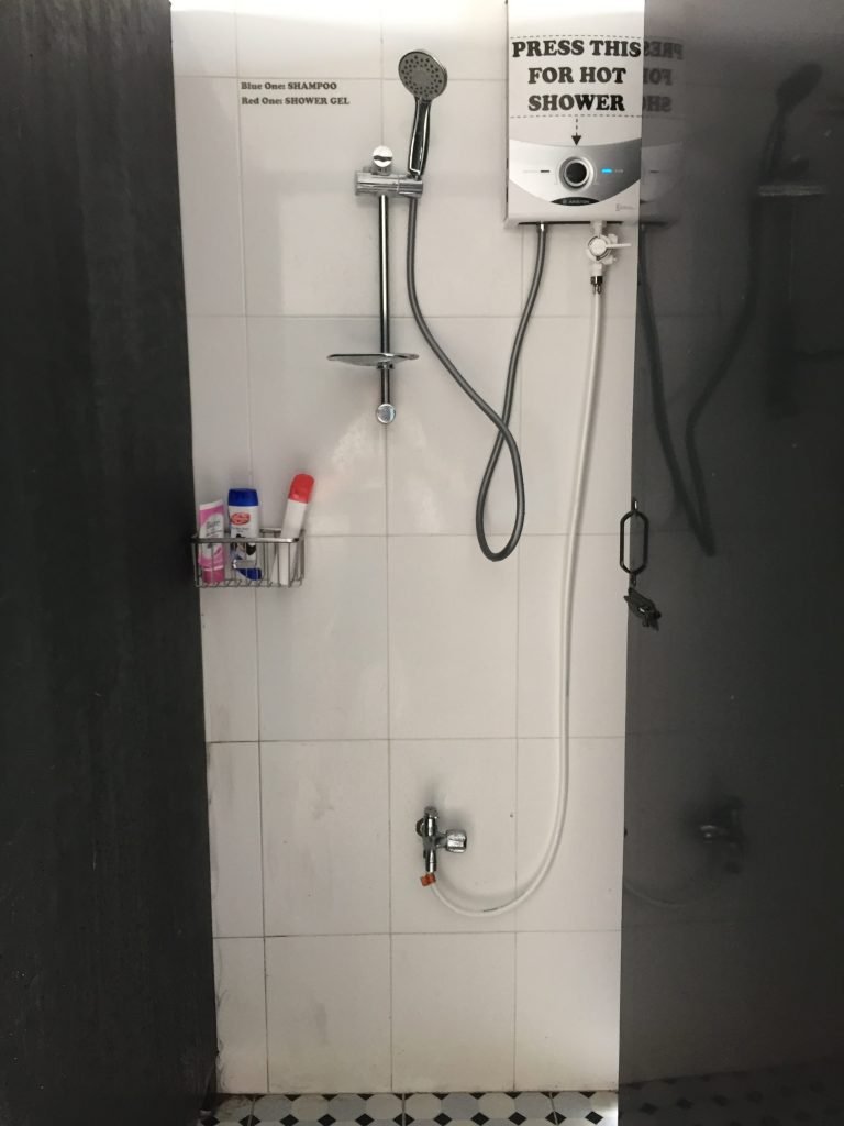 washroom with shampoo, shower gel, facial cleanser provided at O.M.E hostel - Quy Nhon, Vietnam