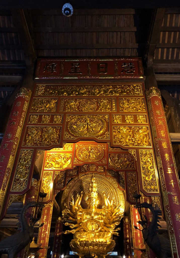 a golden Buddha statue at Bai Dinh Pagoda