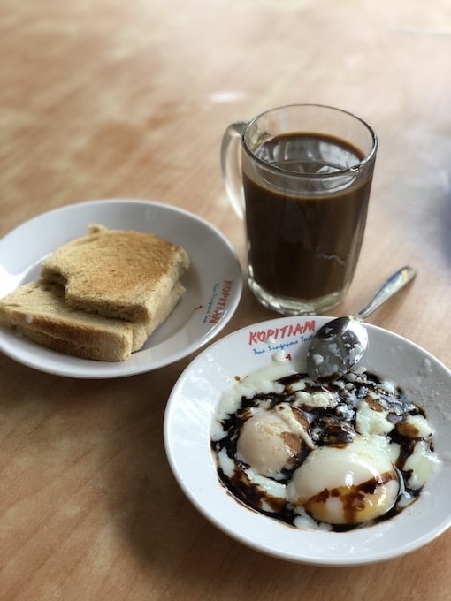 Kaya Toast with Half-cooked eggs, the iconic traditional Singapore breakfast