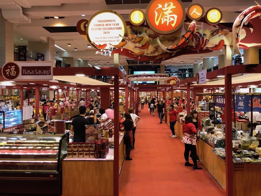 Chinese people selling lunar new year products at Takashimaya, a mall in Singapore
