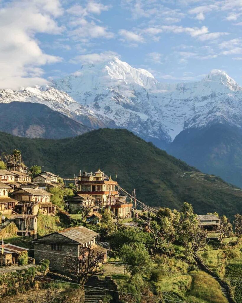 Annapurna mountain range above a traditional Nepalese village