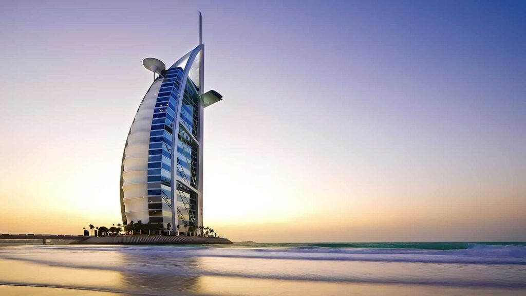 Burj Al Arab sail-shaped hotel standing beside the beach in Dubai