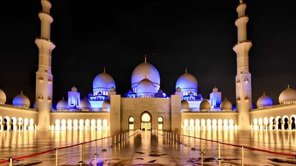Sheikh Zayed Grand Mosque illuminated at night in Abu Dhabi