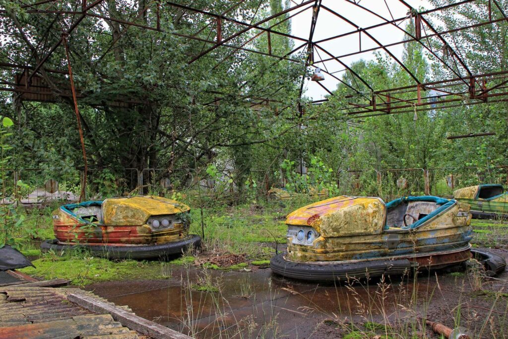 forgotten bumper car in Chernobyl, one of the well-known abandoned places across the world
