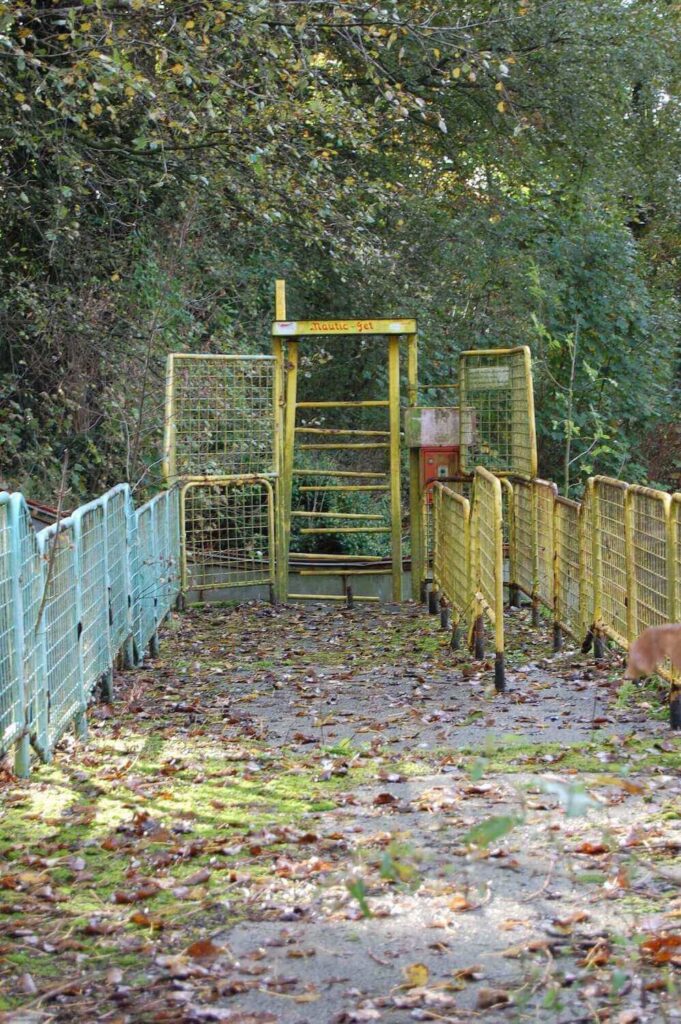a ruined gate at dadipark, one of the abandoned amusement parks in the world