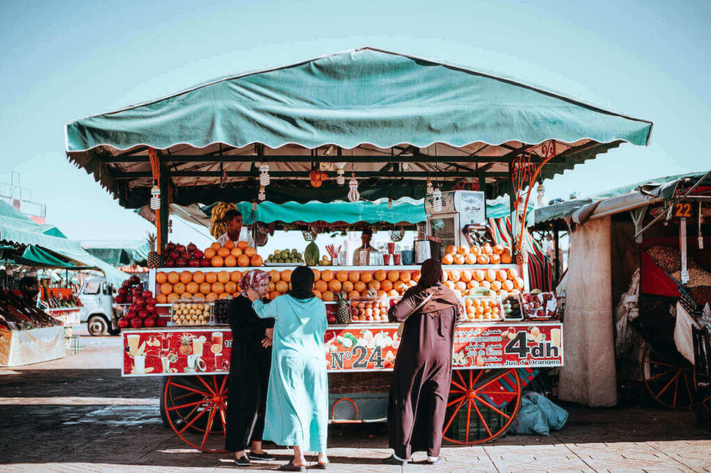 an orange juice vendor in marrakesh