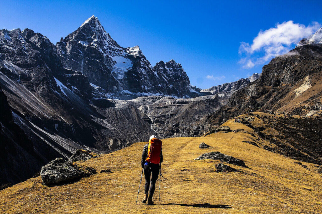 a woman is ascending Everest