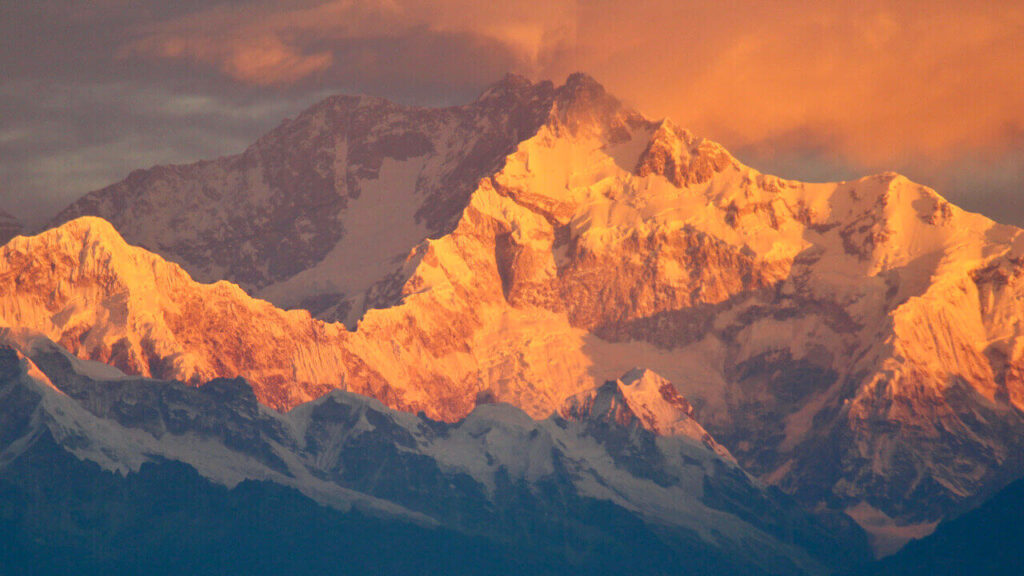 Kangchenjunga's peak is orange when sun rises