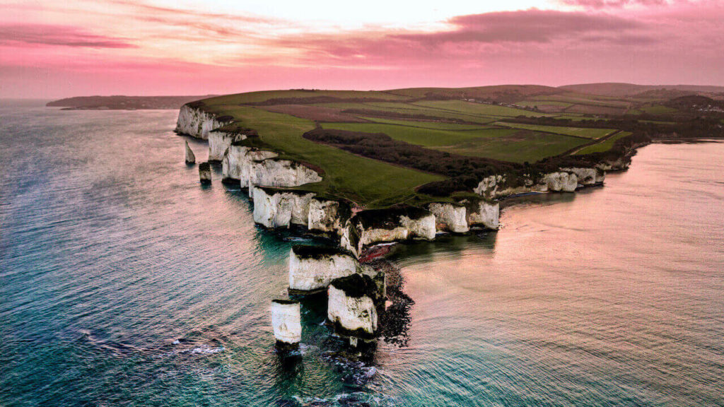 Old Harry Rocks aerial view in the pink sky in the east of Dorset