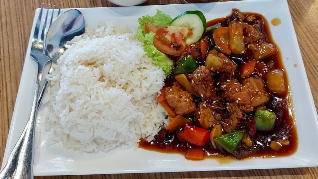 Sweet & Sour Pork with white rice dish at Zhenyi Veggie Place