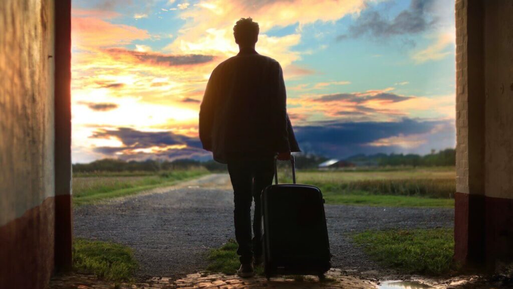 a man travel with his luggage