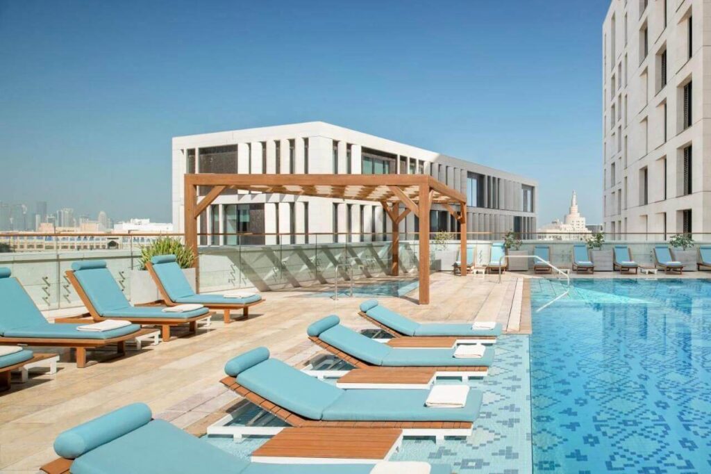 Alwadi Hotel Doha rooftop pool with view to the downtown and city