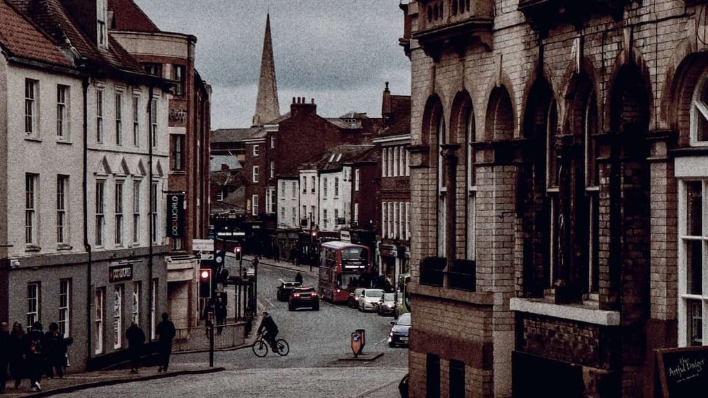 Historic street in York, England, with traditional architecture and an atmospheric setting for a Halloween getaway.