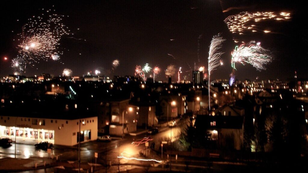 Reykjavik locals buy and do fireworks to celebrate New Year's Eve