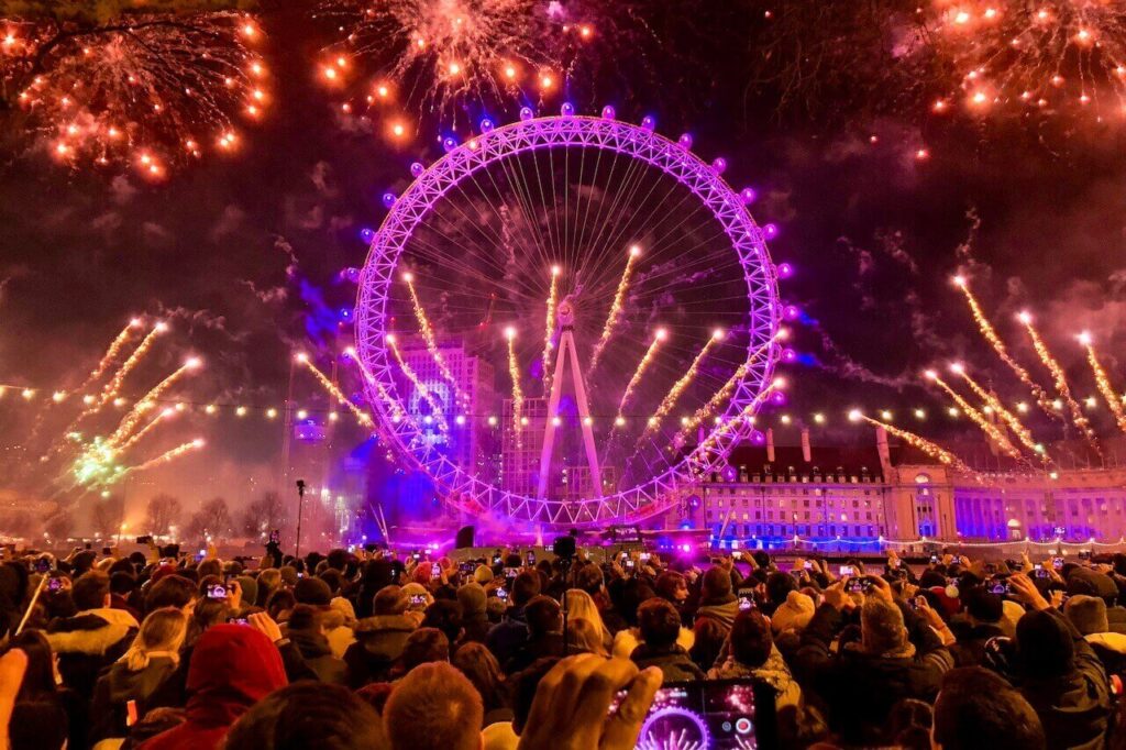 People gather at the London Eye to celebrate New Year's Eve