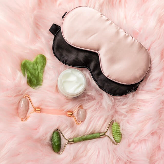 pink and black eye masks and relaxing tools