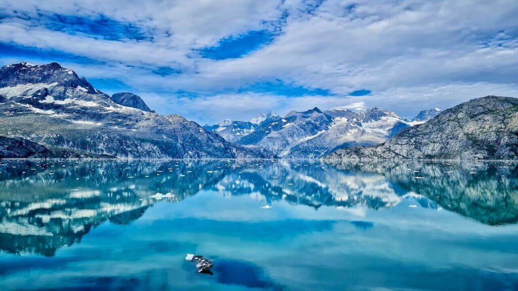 The reflection landscape of Glacier Bay - one of the best travel destinations for Pisces zodiac sign