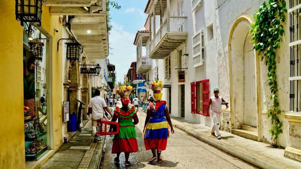 ladies in colored clothes on colombia cartagena street