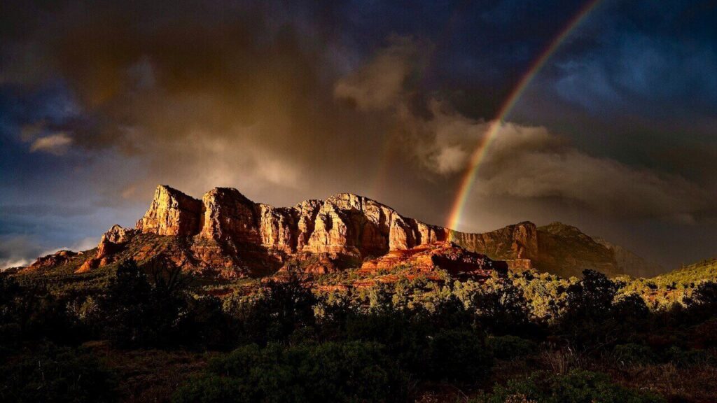 red rock sedona mountains and a rainbow