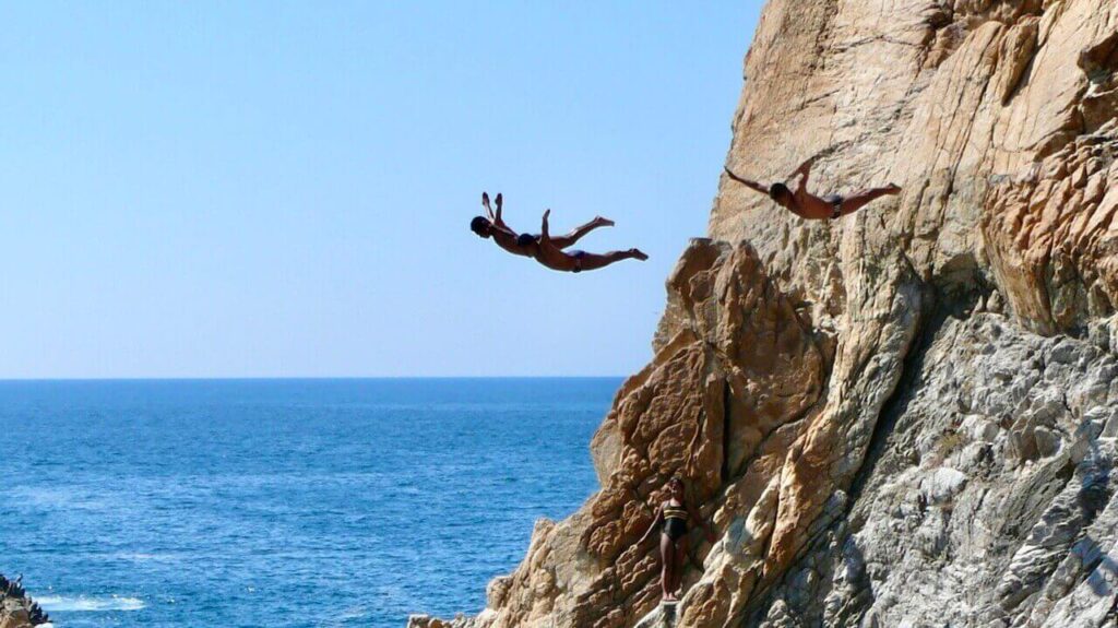 The La Quebrada cliff divers are jumping off the cliff
