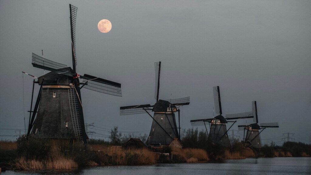 The old windmills of Kinderdijk, Amsterdam under a full moon