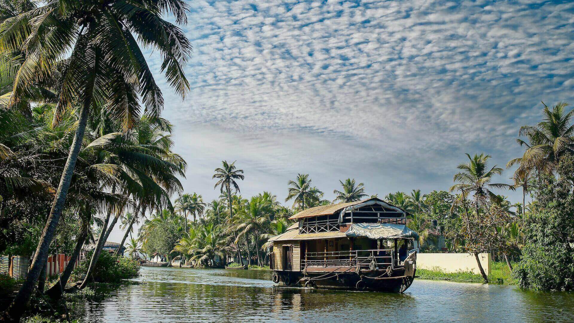A houseboat in backwater of Alappuzha, Kerala one of the best places to visit in South India