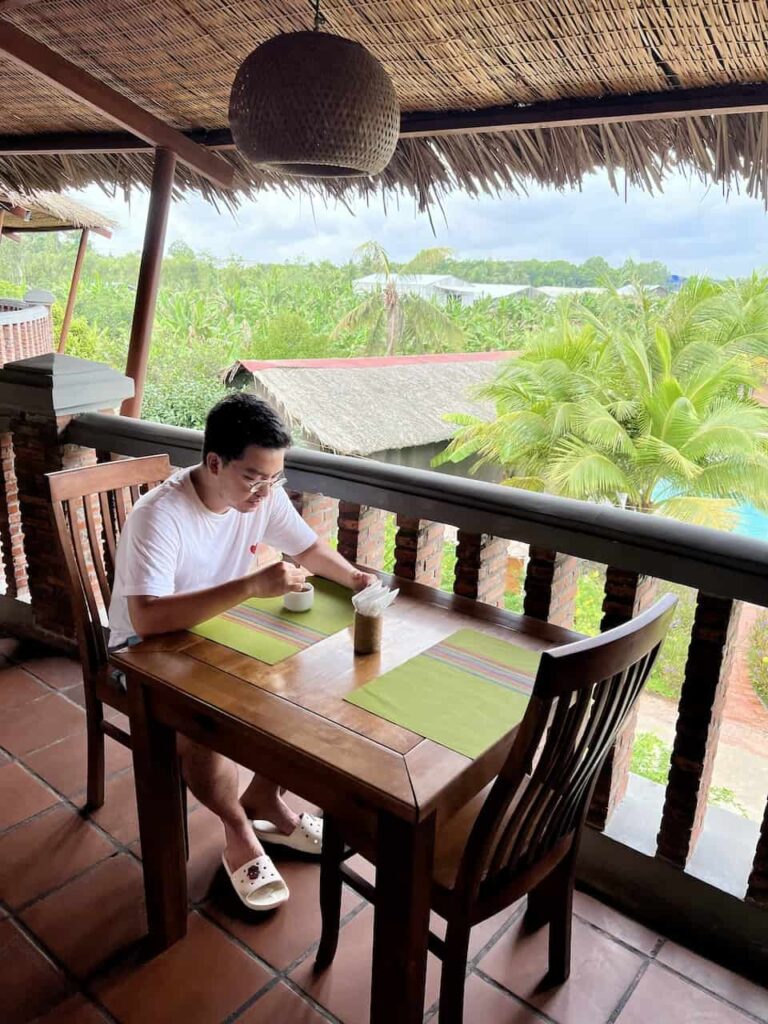 having a morning coffee after breakfast at Can Tho Ecolodge's restaurant