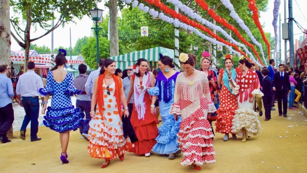 ladies are dressing in Andalusian costumes for the La Feria de Abril festival in Spain