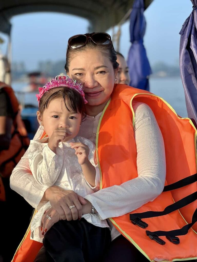 Mira and her grandma on the boat