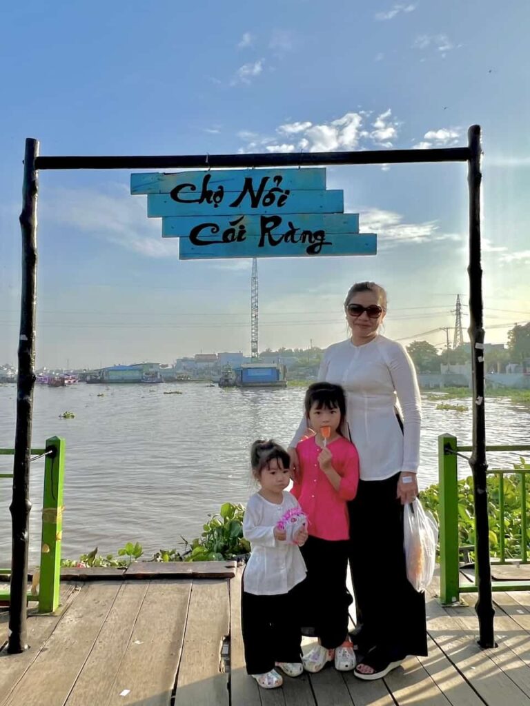 the kids and grandma at cai rang floating market can tho