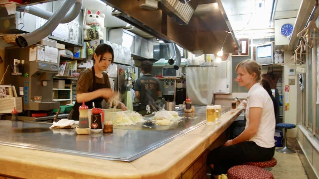 Having Okonomiyaki at okonomi-mura culinary village