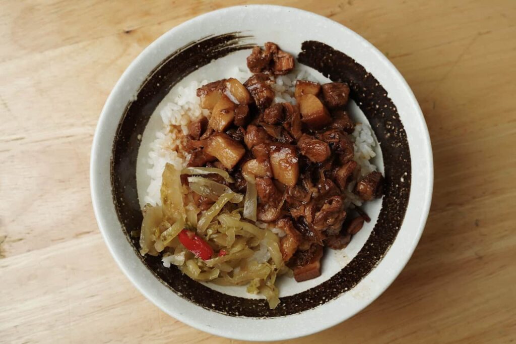 Lu Rou Fan, Taiwan's famous braised pork rice served with pickled vegetables, a classic Taiwanese comfort food