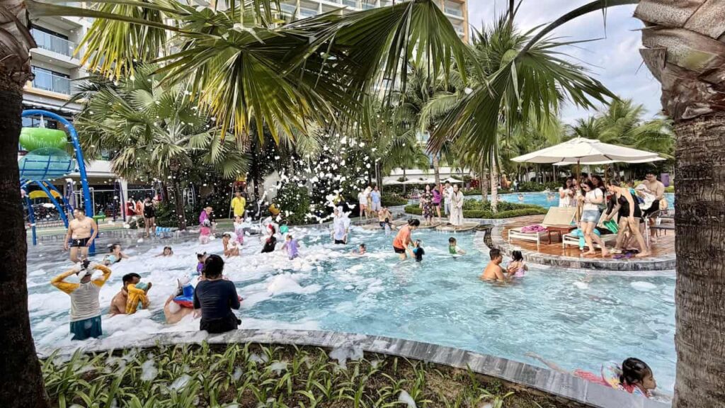 Families enjoying the lively foam party at the swimming pool at Dhawa Ho Tram.