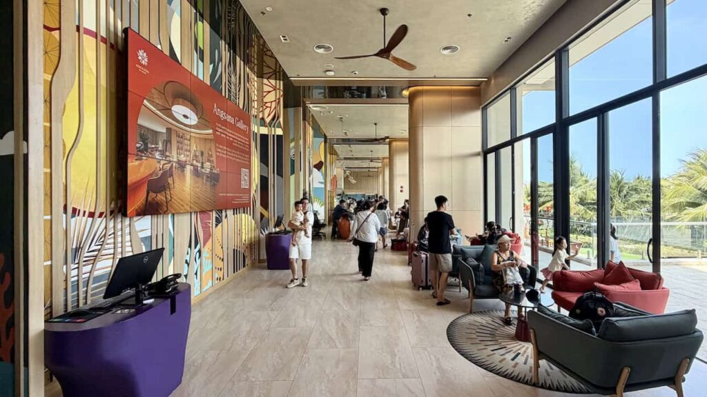 Guests waiting in the lobby during the check-in process at Dhawa Ho Tram.