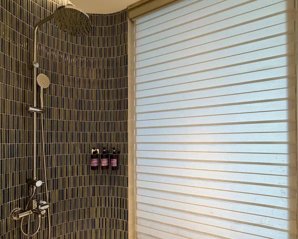 Walk-in rain shower with Banyan Tree toiletries at Dhawa Ho Tram.