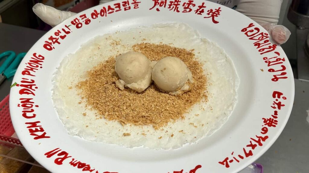 Peanut ice cream roll with shaved peanut candy and cilantro, a famous street food in Jiufen Old Street, Taiwan