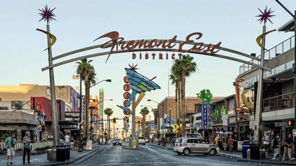 Fremont East District street in Las Vegas with colorful signs and palm trees
