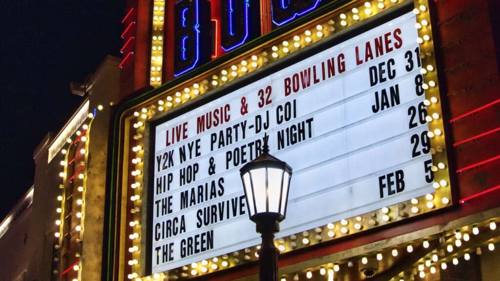 Colorful Las Vegas neon marquee advertising live music and bowling