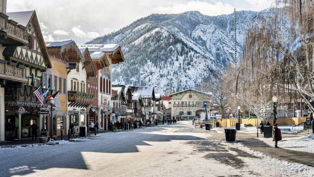 Snow-covered Leavenworth, Washington, with Bavarian-style buildings and mountains
