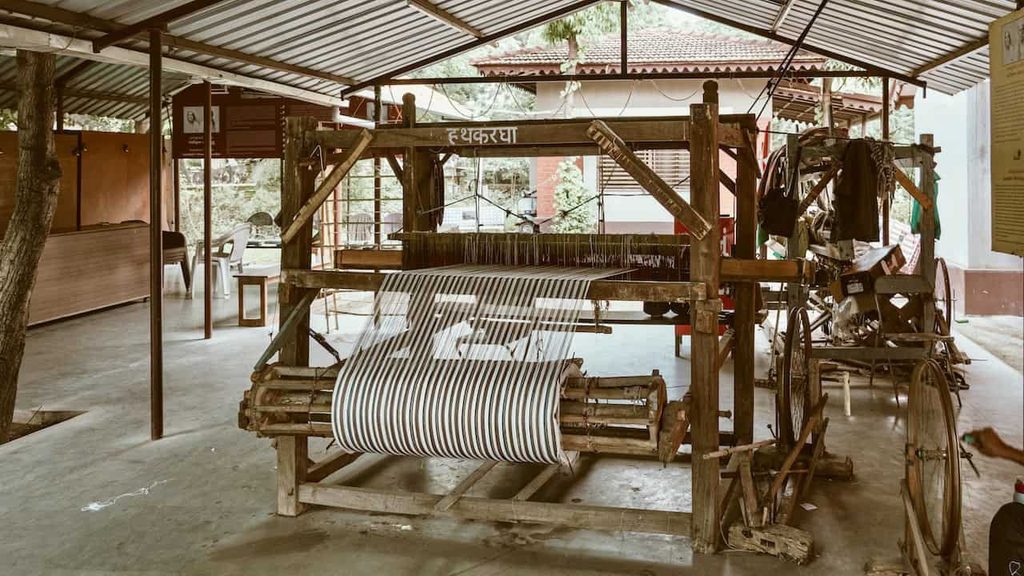 Traditional handloom weaving equipment displayed in a craft workshop