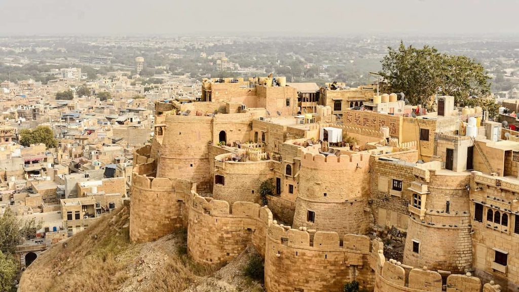 Golden sandstone walls of Jaisalmer Fort overlooking the surrounding city